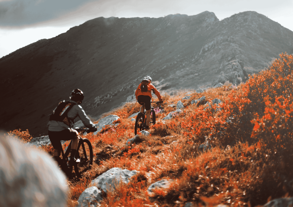 Cyclist Riding Mountain Bike on Hill